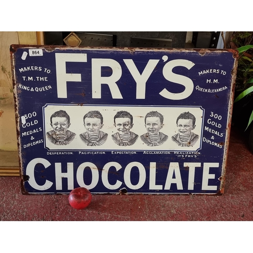 864 - A large metal sign adverting Fry's Chocolate. H50cm x W70cm The iconic image of a young boy wishing ... 