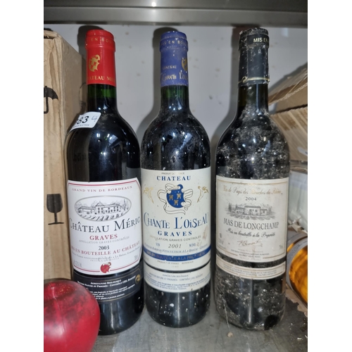 883 - Three sealed 75cl bottles of red wine including Chante L'Oiseau Graves 2001, Mas De Longchamps 2004 ... 