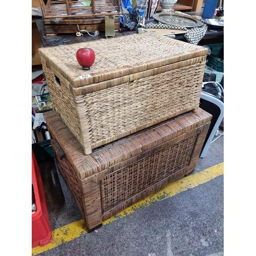 892 - Two large wicker trunks including one with handles to side. H48cm x W78cm x D49cm and H32cm xW67cm x... 