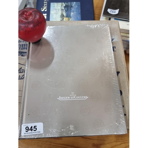 945 - A hardback book titled 'Jaeger - LeCoultere' 2013/2014 edition. In sealed plastic wrapping.