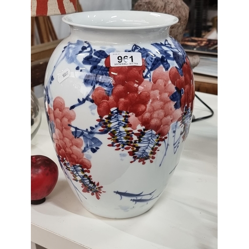 961 - A beautiful large Chinese porcelain urn in vibrant tones of red, blue and white, makers mark to base... 