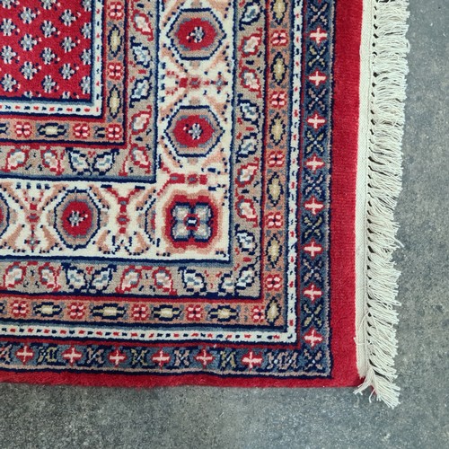 756 - Star Lot : A fabulous quality hand knotted and hand finishes, wool and cotton Indian rug in a geomet... 