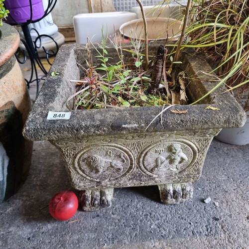 848 - A large heavy vintage stone garden planter with beautiful molded detail and held on claw feet.