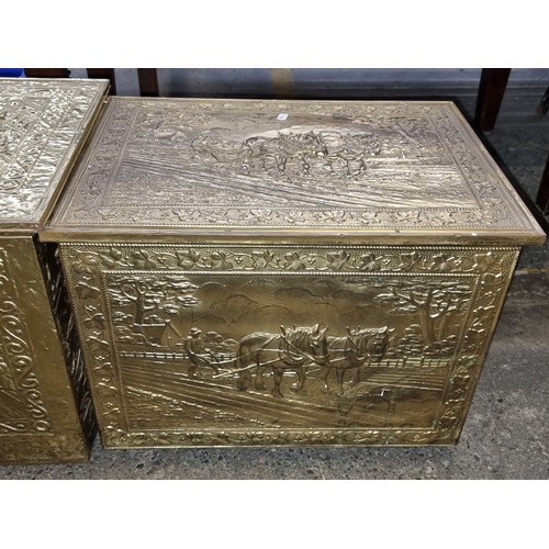 888 - Two vintage brass firewood boxes featuring a tavern and a farming scene. H40cm x W58cm x D35cm.