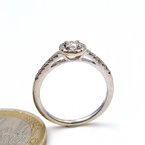 4 - Star Lot : A beautiful sparkling example of a 9 carat white gold multiple Diamond stone ring, set wi... 