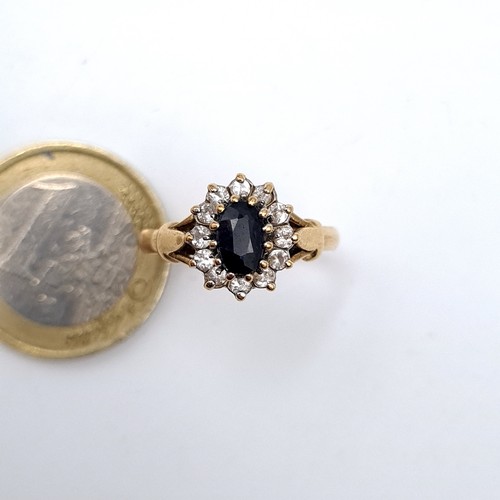 5 - Star Lot : A fine example of a deeply hued Sapphire 9 carat gold ring, featuring a lovely floral clu... 