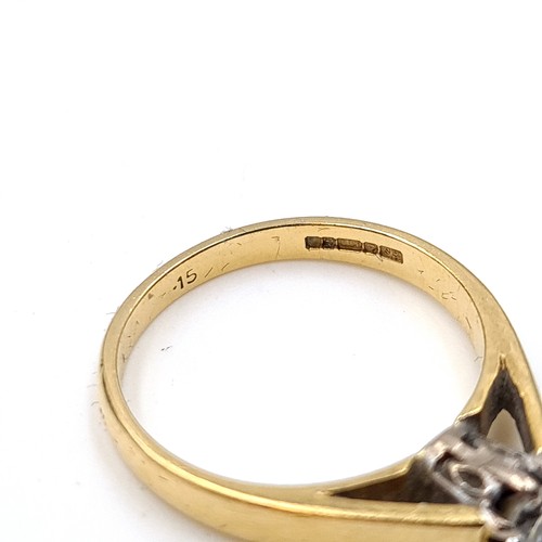 6 - Star Lot : A elegant example of a vintage  bright Diamond solitaire 18 carat gold ring, set with a w... 