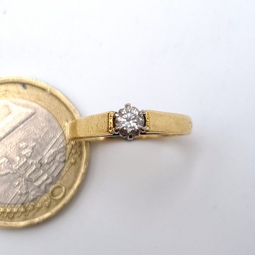 6 - Star Lot : A elegant example of a vintage  bright Diamond solitaire 18 carat gold ring, set with a w... 