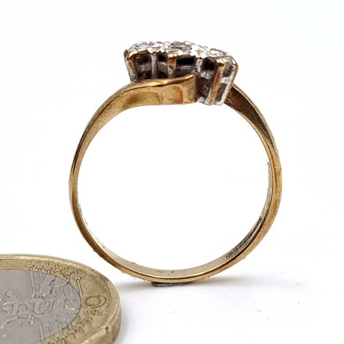 9 - An unusual over lapping three stone Diamond 9 carat gold ring, featuring a pretty twist mount. Ring ... 