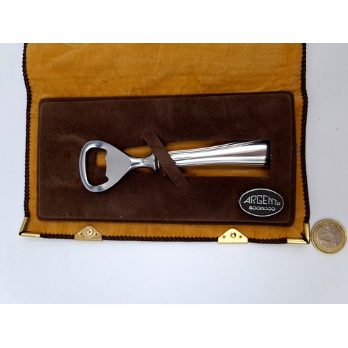 28 - A fine example of a continental silver bottle opener, with a length of 15cm.