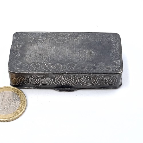 33 - An antique pretty pewter hinged snuff box, set with embossed floral motif and incised detail. Length... 