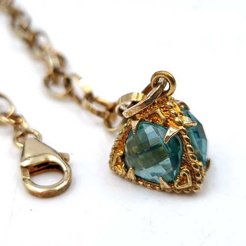 51 - A sterling silver gilt chain link bracelet, set with a jewelled fob. Weight: 10 grams.