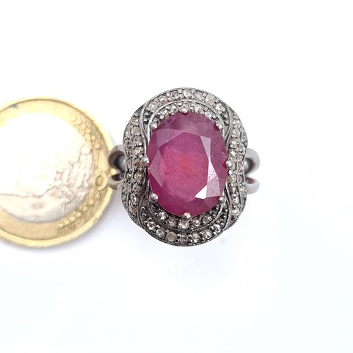 58 - Star Lot : A certified 12.3 carat natural Diamond and Ruby stone ring, mounted in sterling silver an... 