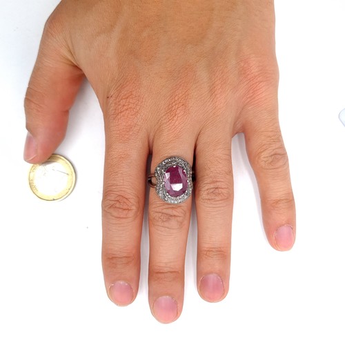 58 - Star Lot : A certified 12.3 carat natural Diamond and Ruby stone ring, mounted in sterling silver an... 