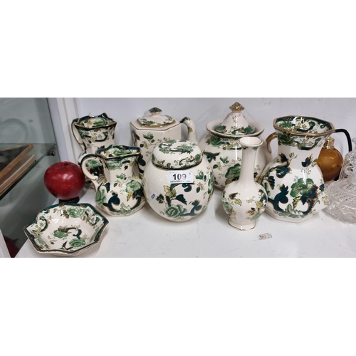 109 - Eight pieces of hand painted Mason's ceramics in the Chartreuse pattern comprising of a teapot, jugs... 