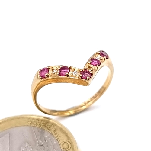 11 - Star Lot : A fine example of a Wish Bone 9 carat gold ring, featuring an array of Diamonds and Rubie... 