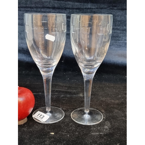 113 - A pair of Waterford Crystal large John Rocha wine glasses in the Geo pattern. In very good condition... 