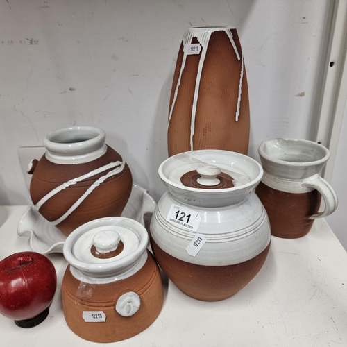 121 - Six pieces of Stephen Pearce pottery including vases, lidded jars, a fluted plate and a jug.