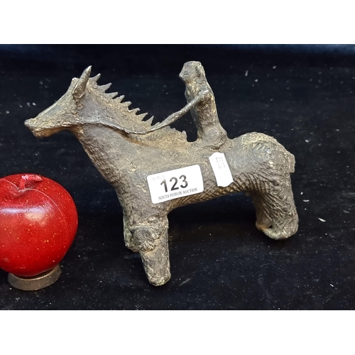 123 - Star Lot : A very rare very old metal figure of a rider on a horse in the primitive style. Crafted f... 