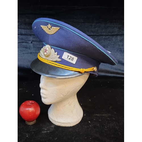 128 - A Soviet military air force peaked cap featuring two emblems.