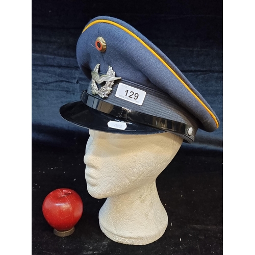 129 - A vintage German military peaked cap from Bamberger Mutzen-Industrie c. 1960s. Features two emblems.