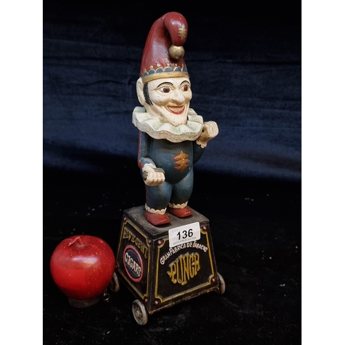 136 - A very fun cast metal money box advertising Five Gent Cigars and featuring Mr punch to top. Held on ... 