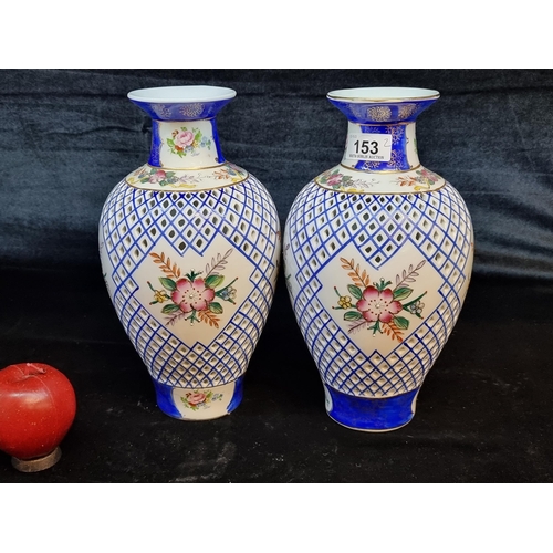 153 - Star lot : A pair of elegant antique  vases with pierced body and floral detailing. In very good con... 