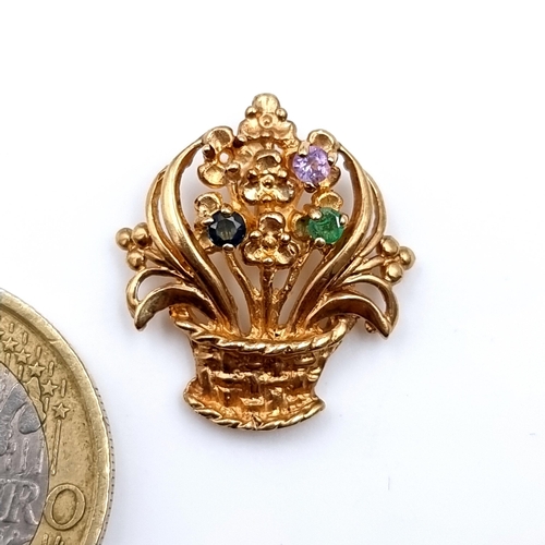 16 - A very attractive vintage 9 carat gold pendant, in the form of a bouquet of flowers and set with Sap... 