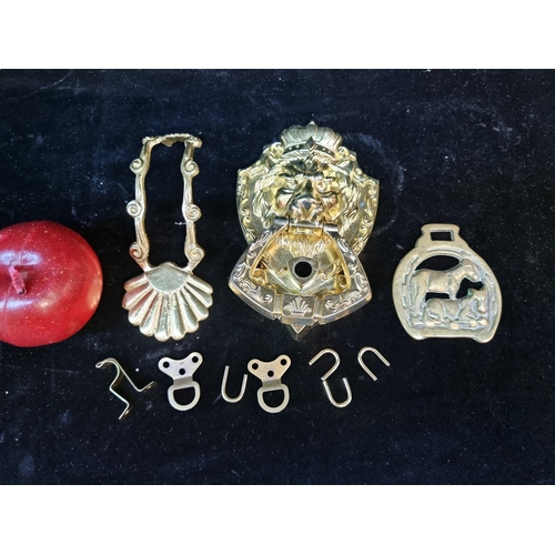 166 - Three brass items including a door knocker with a lion mask.