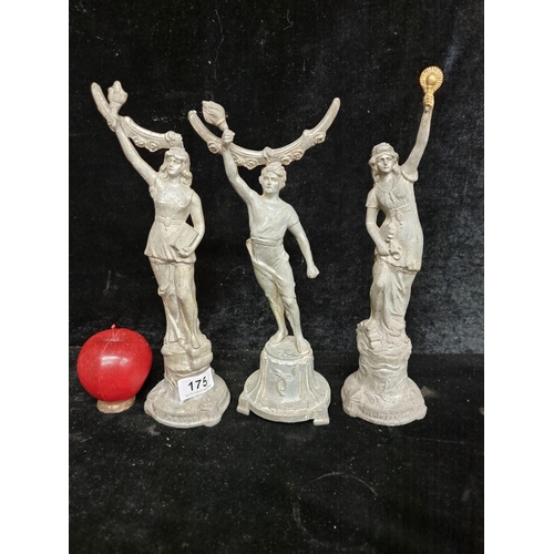 175 - A set of three spelter statues, including 