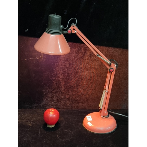 177 - A super retro articulated anglepoise desk lamp, holding an orange toned bulb. In a smart red finish.... 