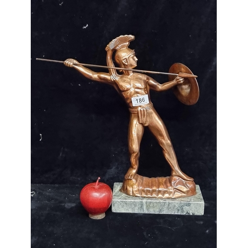 186 - A striking and very heavy vintage copper toned figure titled Metamee.