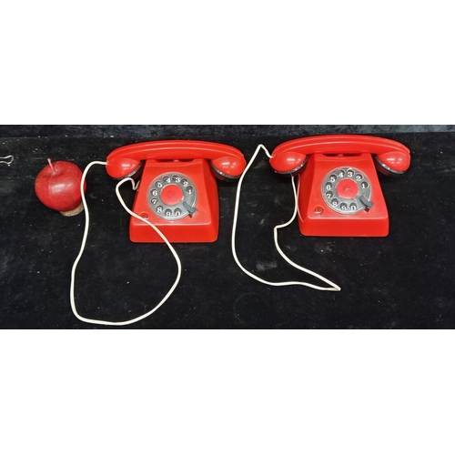 191 - Two vintage Yugoslavian made red  rotary dial telephones.