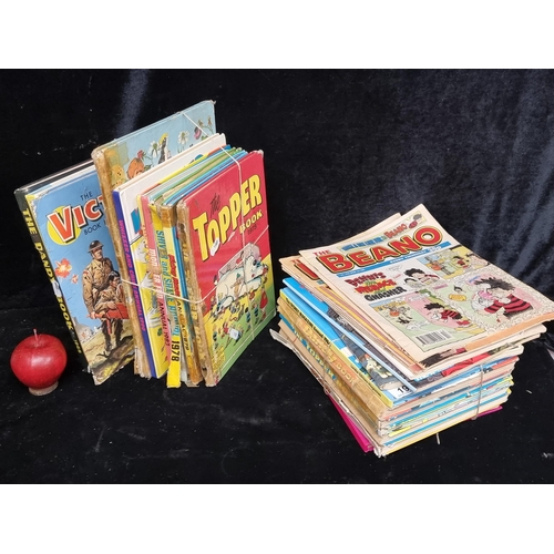 198 - A large collection of vintage comic books and annuals including The Beano, The Muppets and Disney ex... 