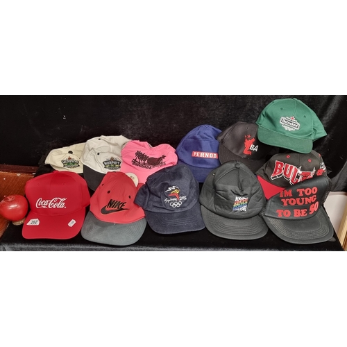 202 - A large selection of vintage baseball caps including Coca-Cola, Murphys, Pernod and Nike examples.