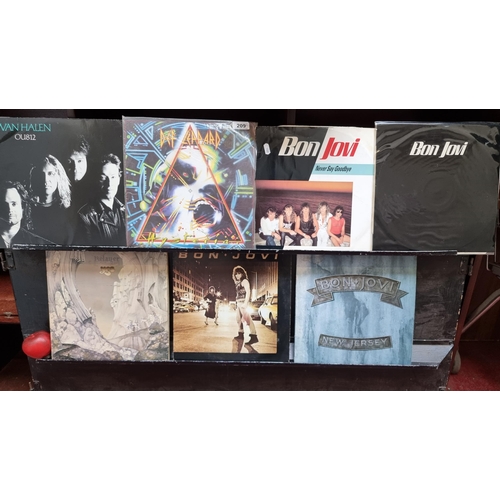 209 - A collection of seven vintage rock vinyl records from artists such as Def Leppard, Bon Jovi x 4,  Va... 