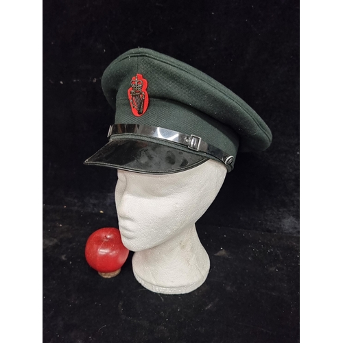 211 - A vintage  Royal Ulster Constabulary cap with Queen's crown cap badge.