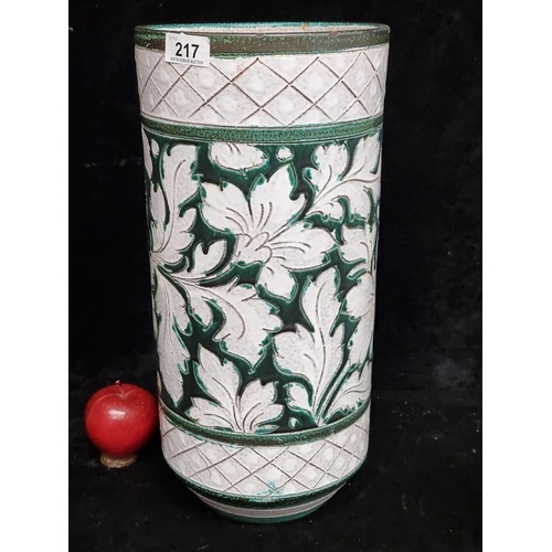 217 - An ornate ceramic umbrella stand featuring a foliate motif. H43cm In very good condition.