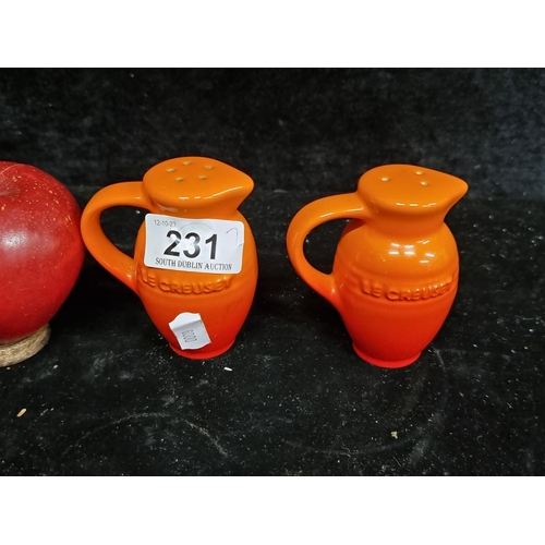 231 - A set of Le Creuset salt and pepper shakers in jug form. In very good condition.