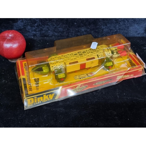 236 - A vintage Dinky die cast Eagle Transporter in original box.