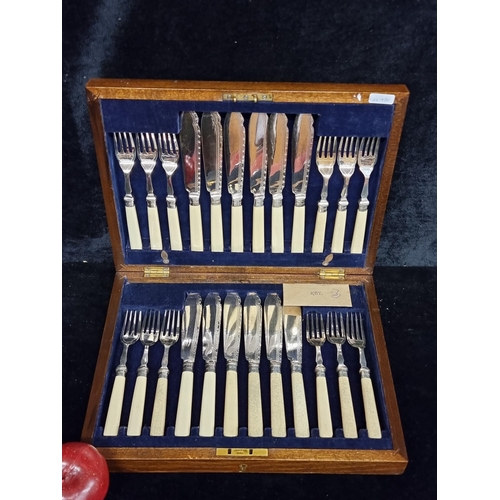 237 - A fabulous Edwardian canteen of cutlery with silver bands. A complete collection with original key.