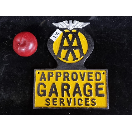 238 - A heavy cast metal advertising wall sign reading AA approved garage services.