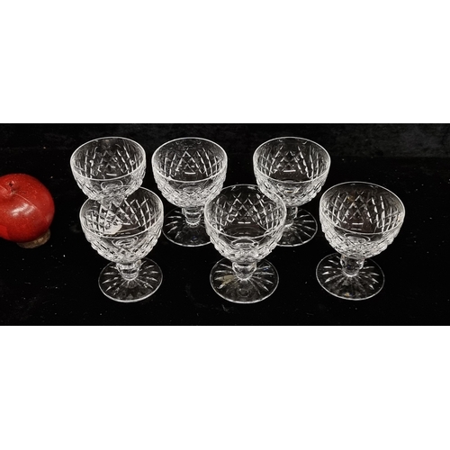 249 - A set of six Waterford Crystal stemmed glasses in the Lismore pattern. All in good condition with ac... 