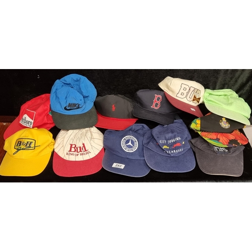 253 - A wonderful set of thirteen vintage advertising baseball caps including a Benson and Marlboro exampl... 