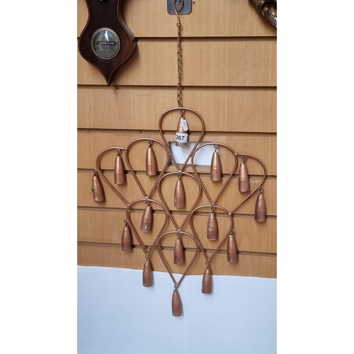 267 - A copper metal 16 bell wind chime / wall hanging.