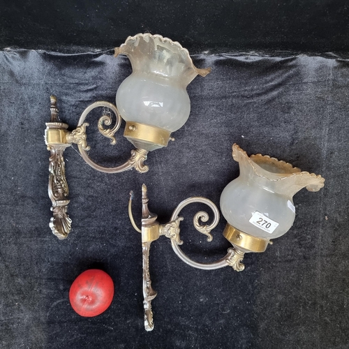 270 - Two vintage wall lights with brass frames and opaque shades with flared rims.  In very good conditio... 