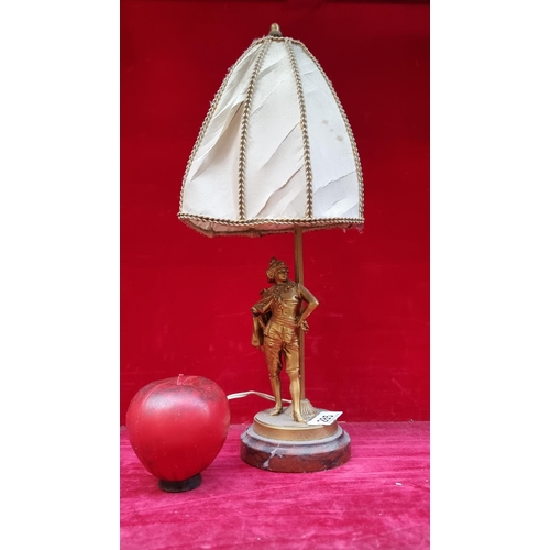 285 - A charming vintage table lamp with figure to stem. Held on a marble base. 
Might benefit from a new ... 