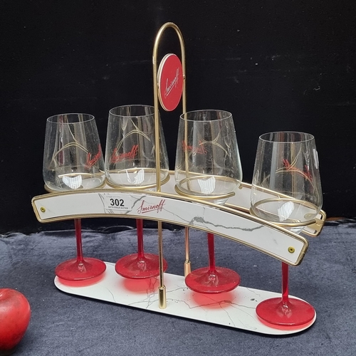 302 - A very cool vintage  Smirnoff branded Vodka glass rack, holding four Smirnoff branded stemmed glasse... 