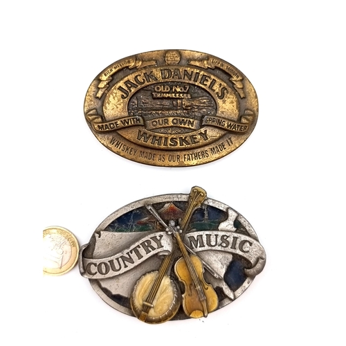 38 - Two quirky American belt buckles, the first is Jack Daniels advertising example. Together with a fur... 