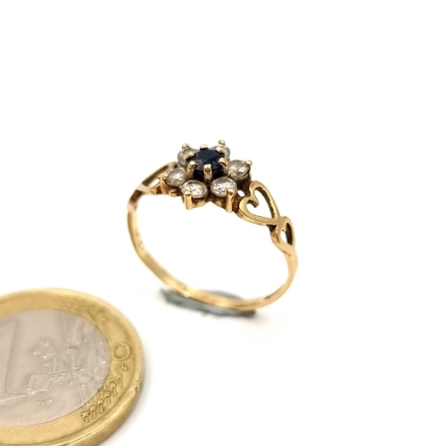 51 - An unusual vintage 9 carat gold gem set Daisy cluster ring, featuring a pretty heart shaped dual set... 